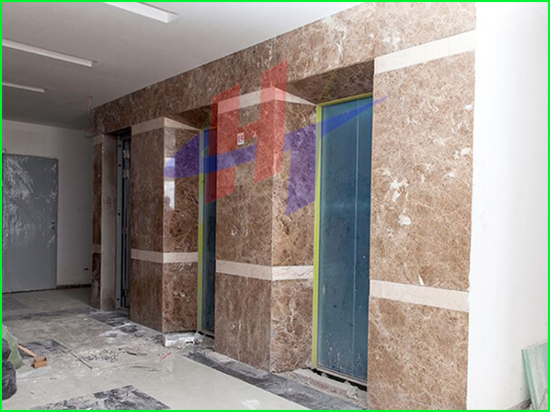 tấm nhựa vân đá ốp cửa cầu thang máy -1